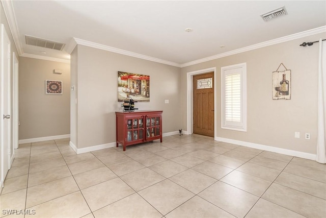 foyer entrance featuring crown molding and light tile patterned flooring