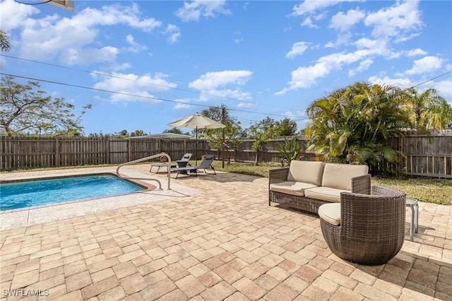 view of pool featuring a patio and outdoor lounge area