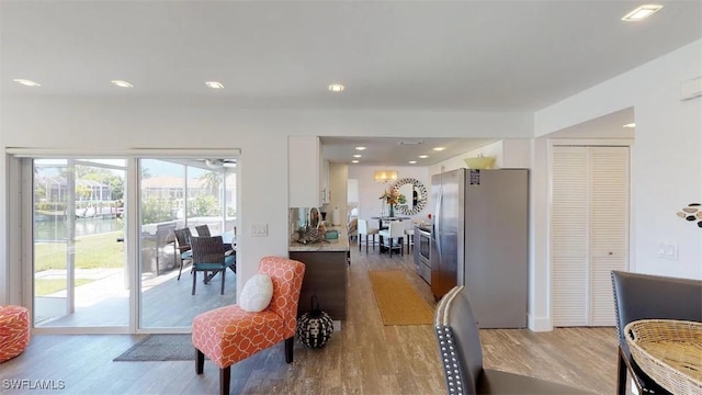 dining space with light wood-type flooring