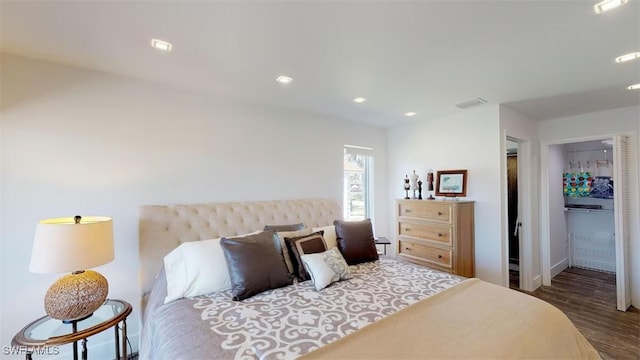 bedroom with dark hardwood / wood-style floors