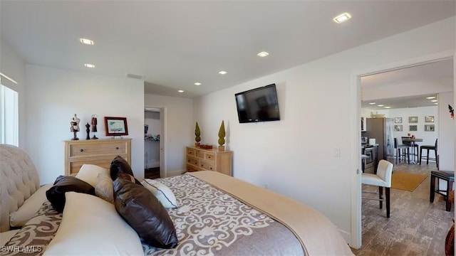 bedroom with hardwood / wood-style floors