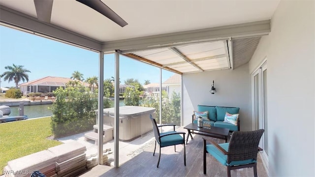 sunroom with a water view