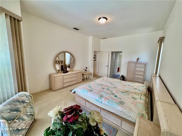 bedroom featuring carpet floors and visible vents