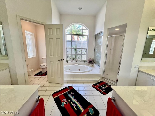 full bathroom with toilet, a whirlpool tub, tile patterned flooring, vanity, and a shower stall