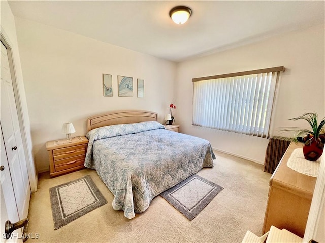 bedroom featuring carpet