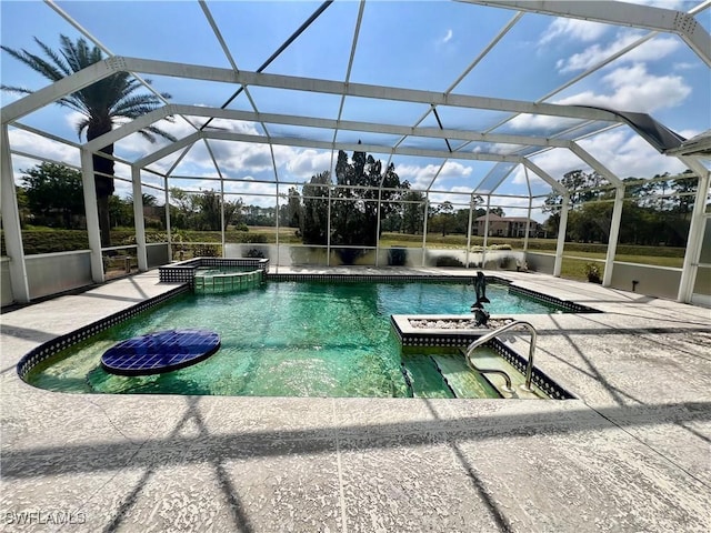 view of pool with a patio area, a lanai, and a pool with connected hot tub