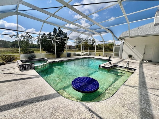 view of pool with a patio area, a lanai, and a pool with connected hot tub