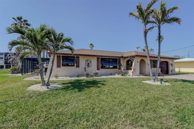 view of front facade featuring a garage and a front lawn