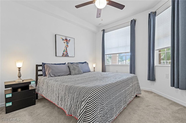 bedroom featuring ceiling fan and light colored carpet