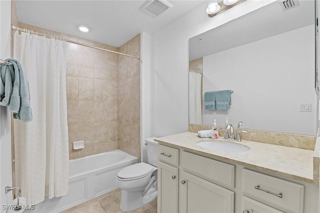 full bathroom featuring vanity, tile patterned floors, toilet, and shower / bath combo