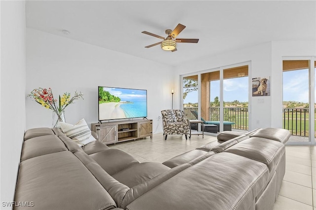 tiled living room featuring ceiling fan