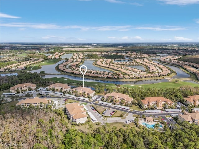 birds eye view of property featuring a water view