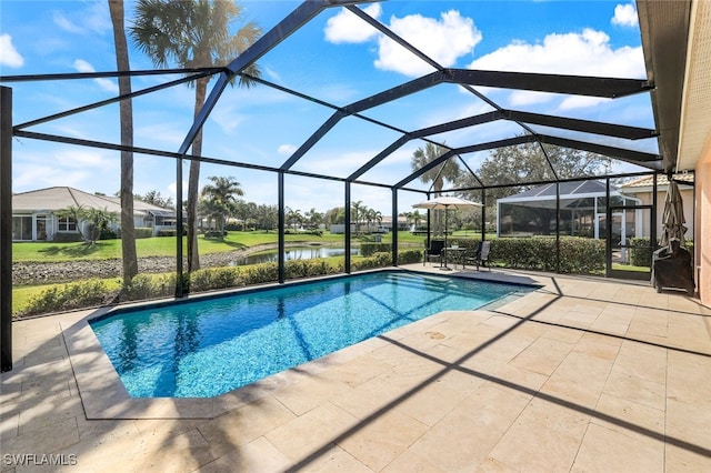 view of swimming pool featuring a lanai, a patio, and a water view