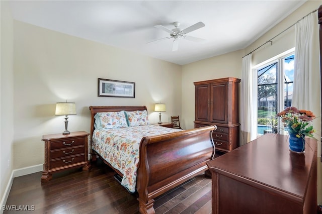 bedroom featuring dark hardwood / wood-style floors, access to exterior, and ceiling fan