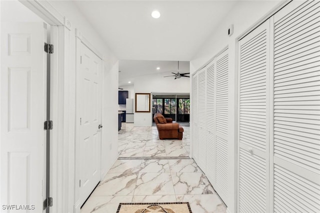 corridor with vaulted ceiling