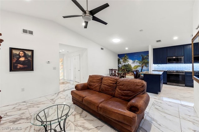 living room with ceiling fan and vaulted ceiling