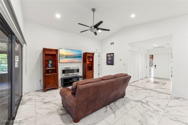 living room with high vaulted ceiling and ceiling fan