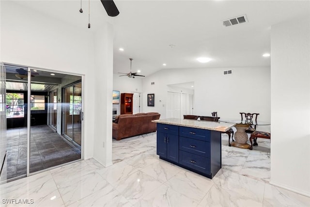 kitchen with a kitchen island, high vaulted ceiling, a kitchen bar, ceiling fan, and blue cabinetry