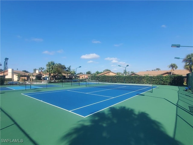 view of sport court featuring basketball hoop