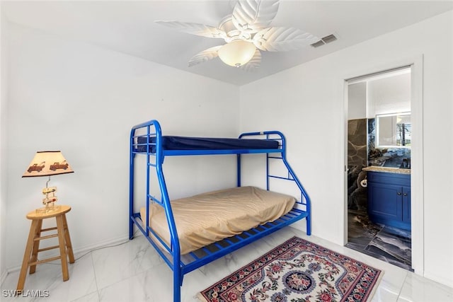 bedroom featuring ensuite bathroom and ceiling fan