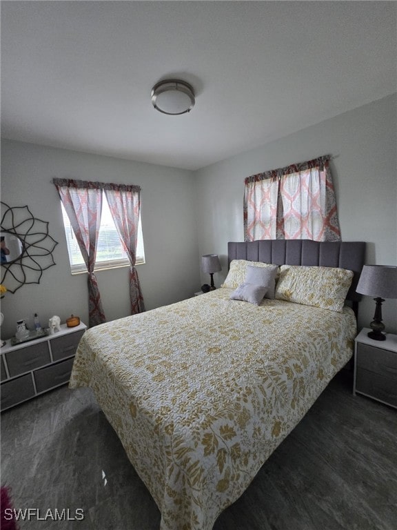 bedroom featuring dark hardwood / wood-style flooring