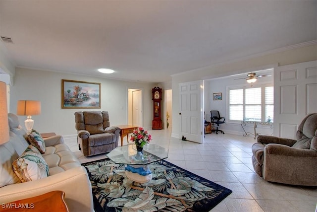 living room with ceiling fan, ornamental molding, and light tile patterned floors