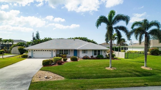 single story home with a garage and a front lawn