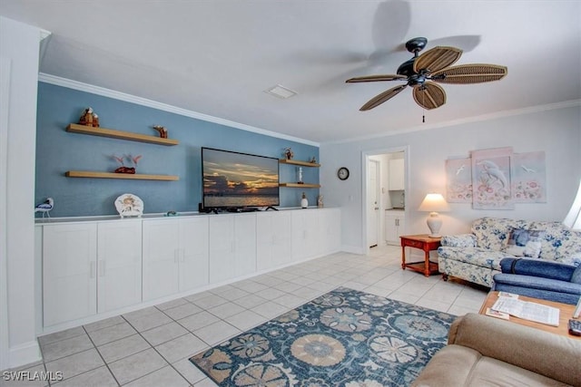 tiled living room featuring ceiling fan and ornamental molding