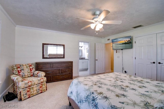 carpeted bedroom featuring crown molding, ensuite bathroom, a textured ceiling, and ceiling fan