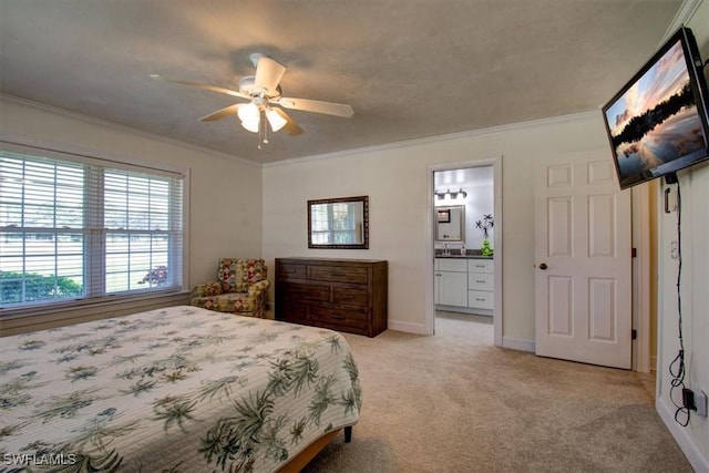 bedroom featuring ceiling fan, light colored carpet, ornamental molding, and connected bathroom