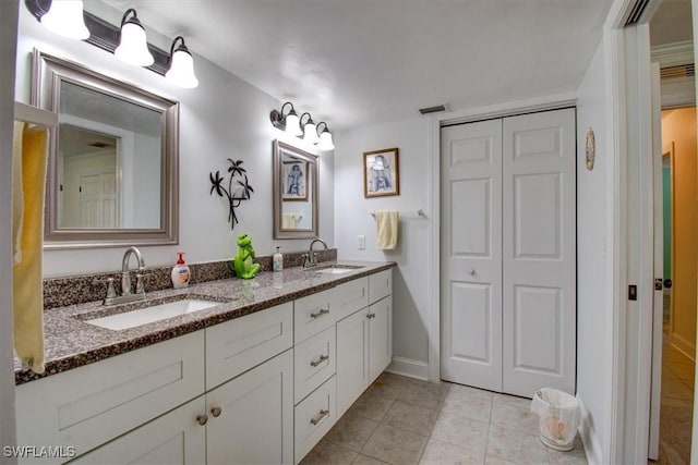 bathroom featuring tile patterned floors and vanity