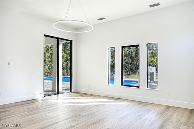 empty room with light wood-type flooring