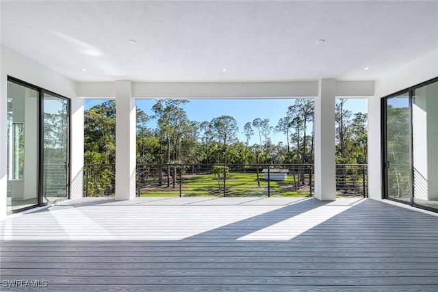 unfurnished sunroom featuring a wealth of natural light