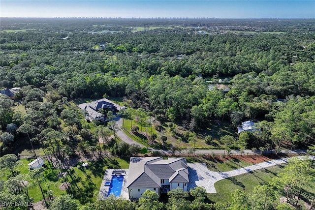 drone / aerial view with a view of trees