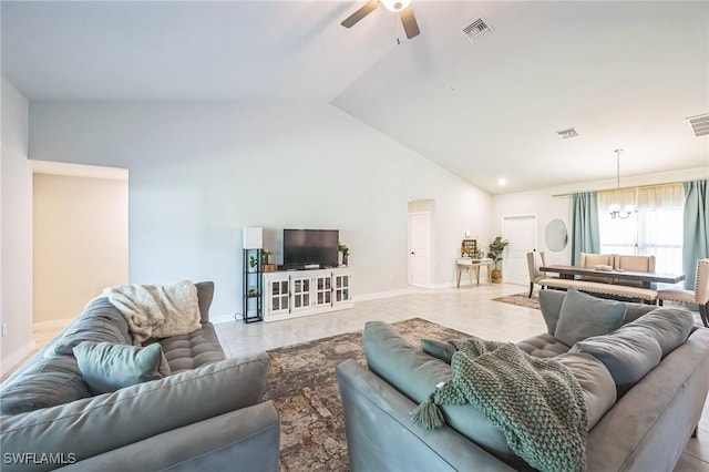 living room with lofted ceiling and ceiling fan with notable chandelier