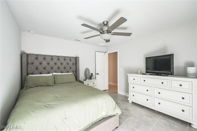 bedroom featuring light tile patterned floors and ceiling fan