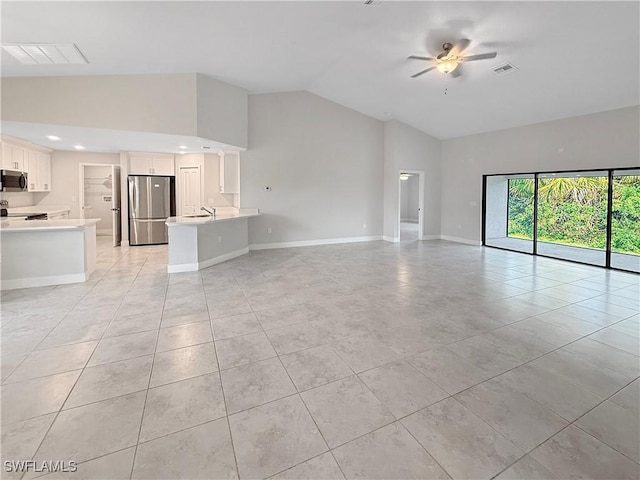 unfurnished living room featuring light tile patterned flooring, ceiling fan, and high vaulted ceiling