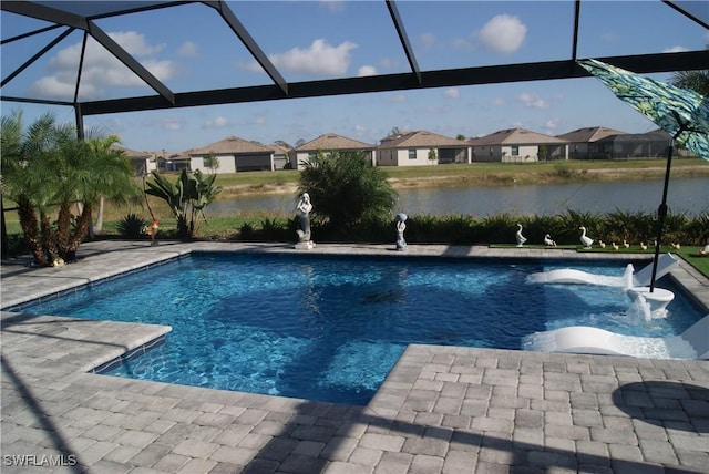 view of swimming pool featuring a water view, a patio, and glass enclosure