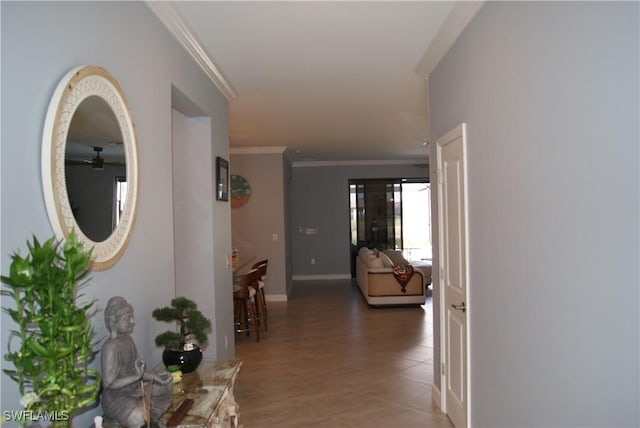 corridor featuring hardwood / wood-style flooring and ornamental molding