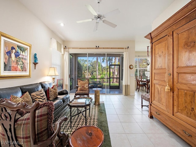 tiled living room with ceiling fan