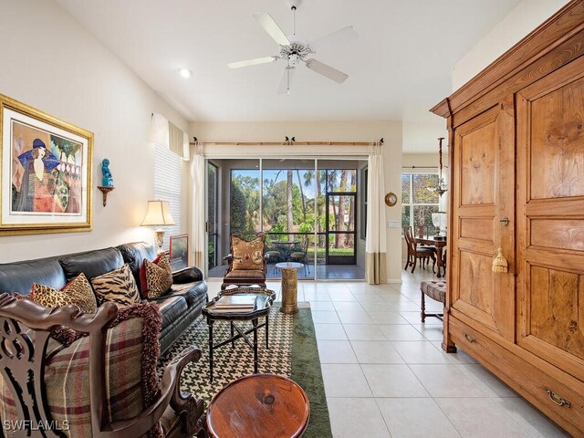 6431 Birchwood Ct, Naples, FL 34109 - living area with light tile patterned floors and a ceiling fan