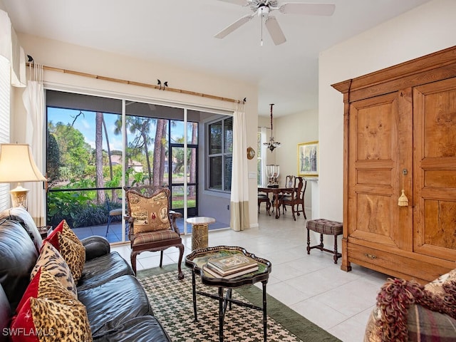 living room with light tile patterned floors and ceiling fan