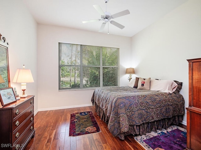 bedroom with dark wood-type flooring and ceiling fan