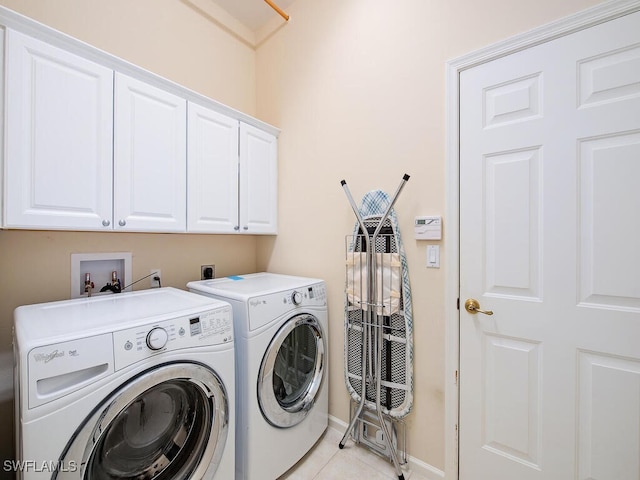 6431 Birchwood Ct, Naples, FL 34109 - washroom with cabinet space, washer and dryer, and light tile patterned floors