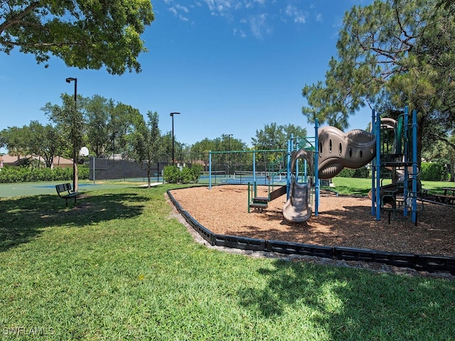 view of playground featuring a lawn