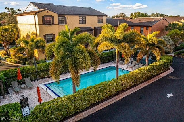 view of swimming pool with a patio area