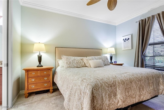 carpeted bedroom featuring crown molding and ceiling fan