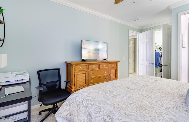 bedroom featuring light colored carpet, ornamental molding, and ceiling fan