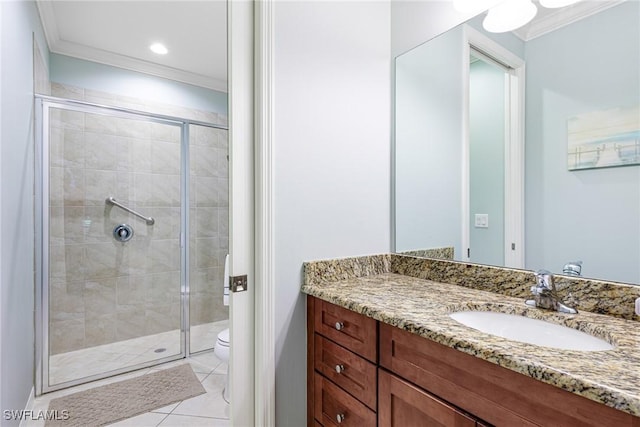 bathroom featuring tile patterned flooring, vanity, ornamental molding, a shower with shower door, and toilet