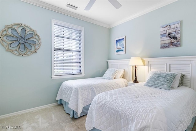 bedroom with ceiling fan, ornamental molding, and light carpet